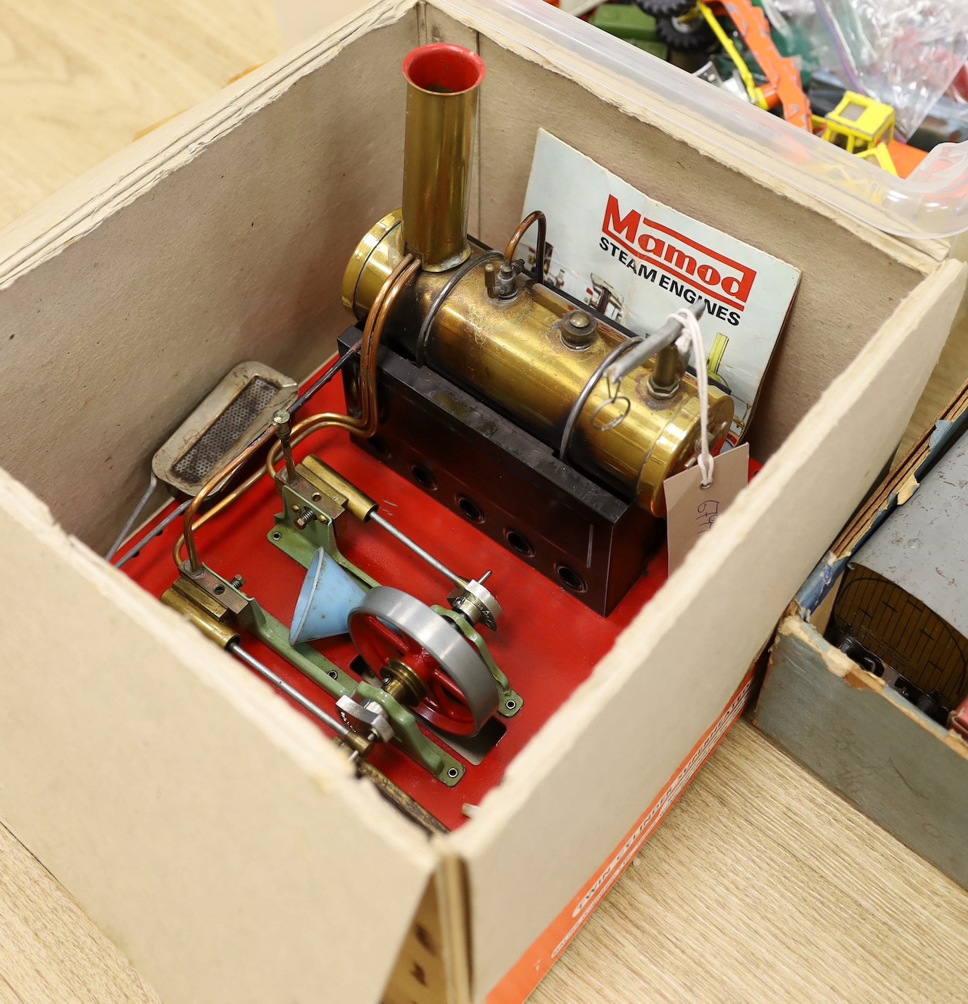 A Mamod steam engine, single cylinder with 6.5cm flywheel, in original box